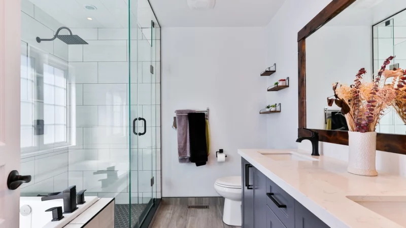 a muted navy blue vanity in a modern bathroom