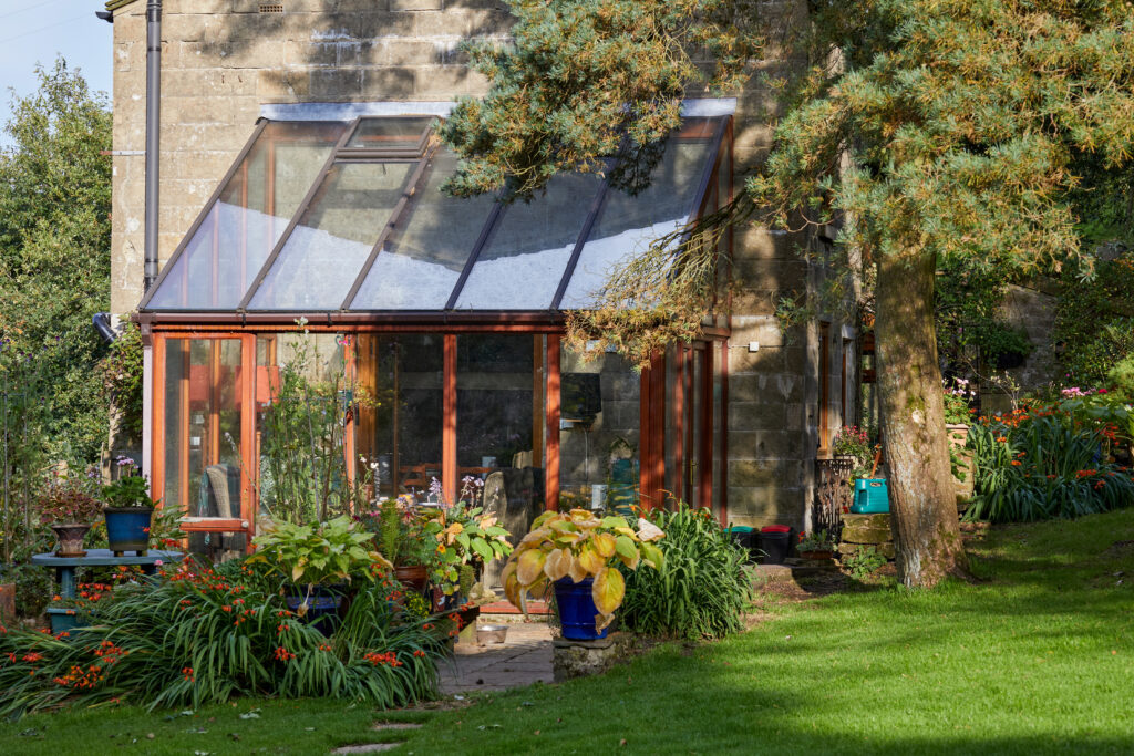 An attached residential greenhouse